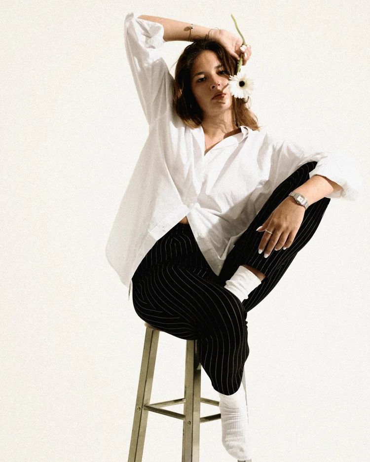 Fashion portrait with a white flower