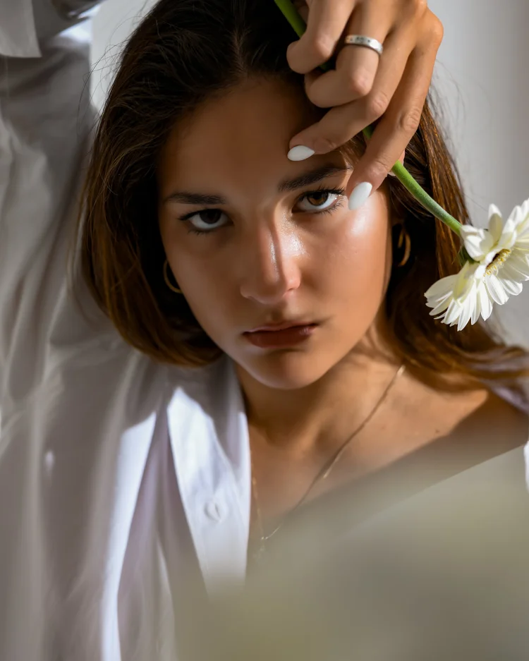 Fashion beauty portrait with a flower